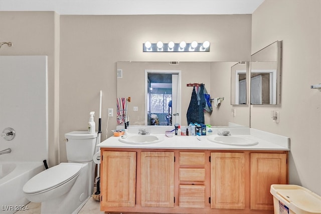 full bathroom with shower / washtub combination, vanity, and toilet