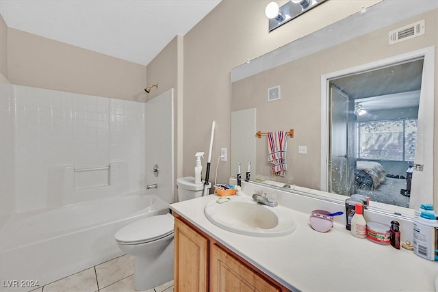 full bathroom with shower / bathing tub combination, tile patterned flooring, vanity, and toilet