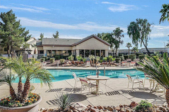 view of swimming pool featuring a patio area