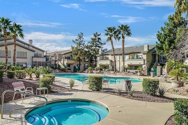 view of pool with a community hot tub