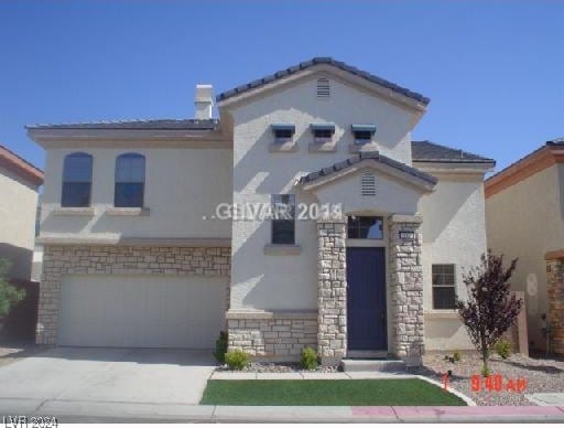 mediterranean / spanish-style house featuring a garage