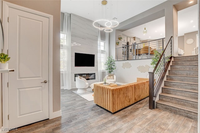 living room featuring wood-type flooring and a fireplace