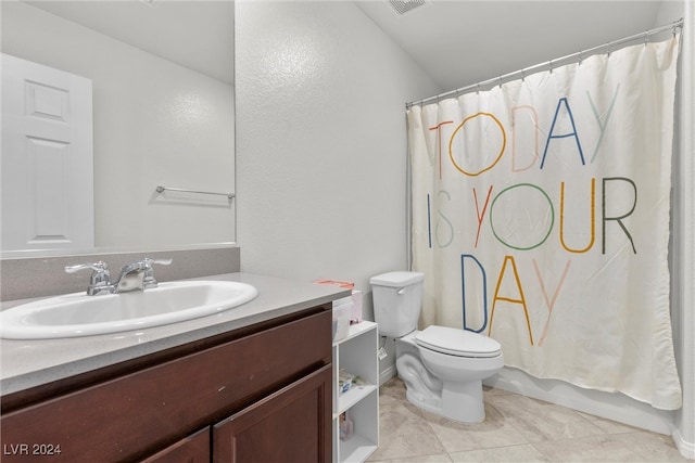 bathroom with a shower with shower curtain, tile patterned flooring, vanity, and toilet