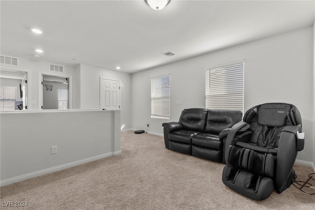 home theater room with light colored carpet