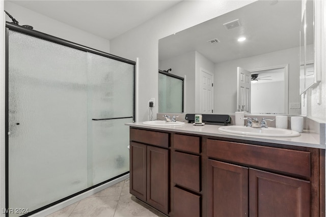 bathroom with tile patterned floors, ceiling fan, walk in shower, and vanity