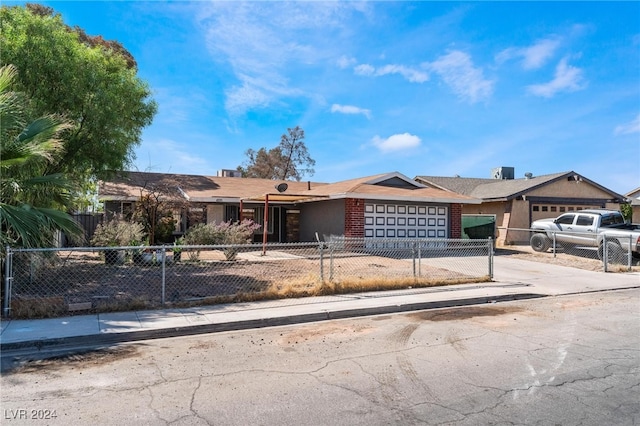 ranch-style home featuring a garage