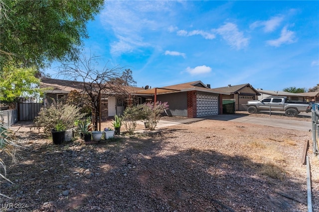 ranch-style home featuring a garage