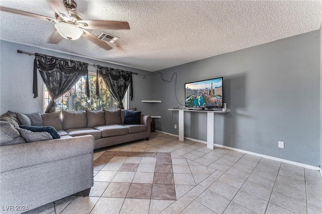 unfurnished living room featuring tile patterned floors, a textured ceiling, and ceiling fan