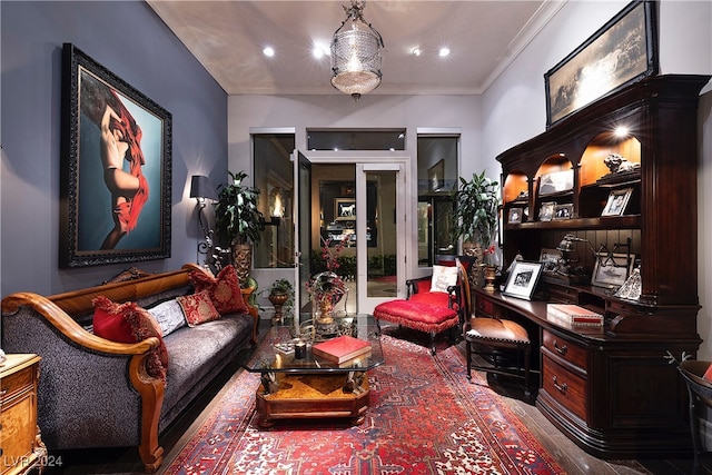 living area featuring crown molding