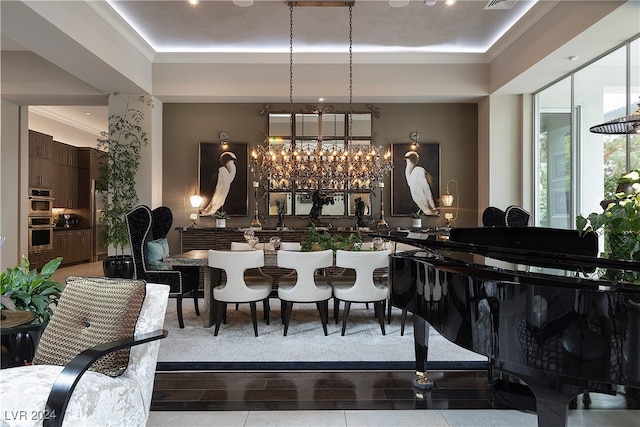 dining space featuring ornamental molding and a notable chandelier