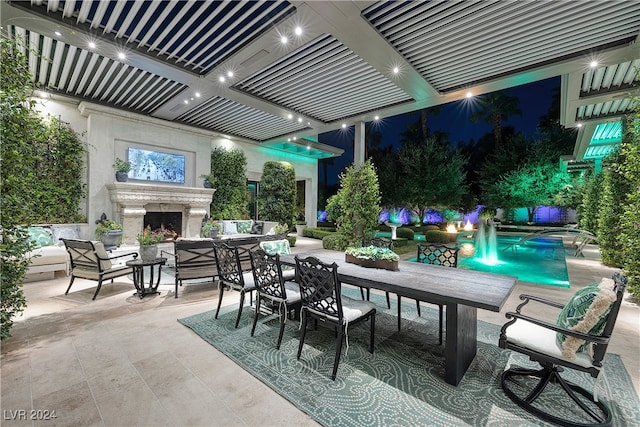 patio at twilight with a fireplace