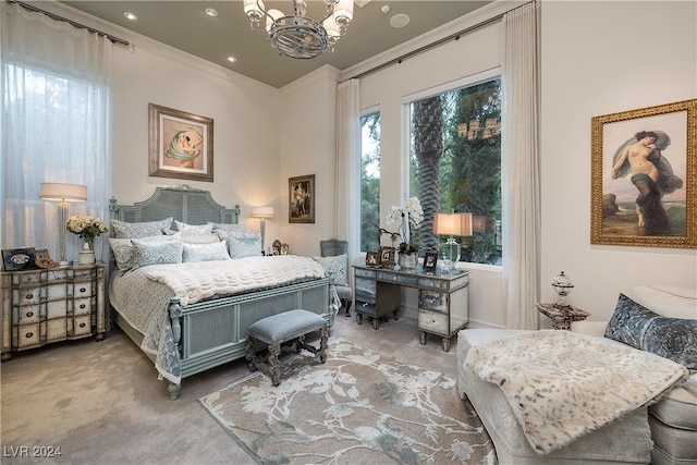 carpeted bedroom featuring a chandelier and crown molding