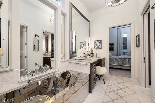 bathroom with vanity and crown molding