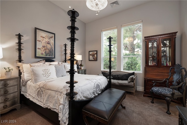 carpeted bedroom with vaulted ceiling