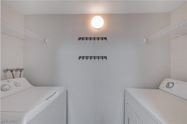 laundry room with separate washer and dryer