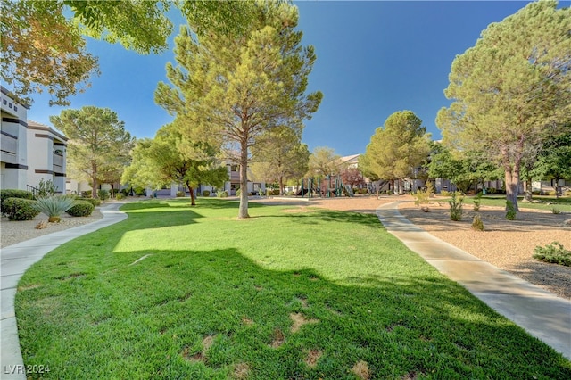 view of property's community with a yard