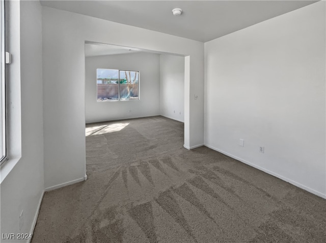 unfurnished room featuring carpet