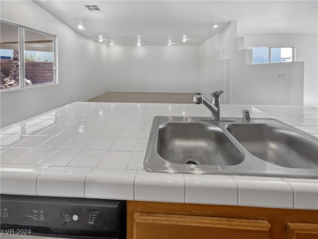 details with tile countertops and sink