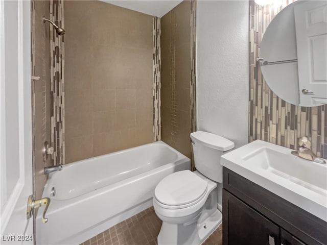 full bathroom featuring vanity, toilet, and tiled shower / bath