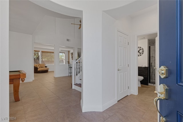 hallway featuring light tile patterned floors