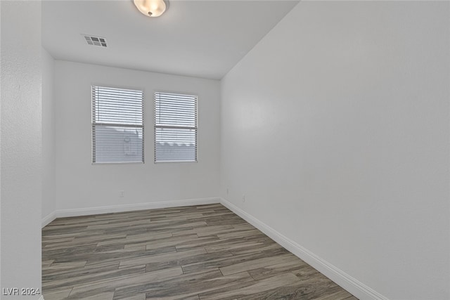 unfurnished room featuring wood-type flooring