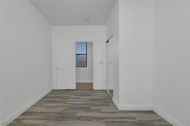 empty room with wood-type flooring