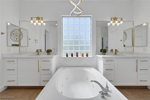 bathroom featuring independent shower and bath, vanity, and tile patterned floors