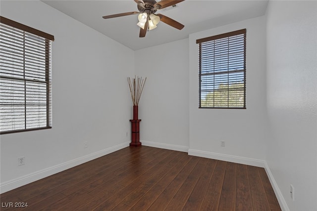 unfurnished room with ceiling fan and dark hardwood / wood-style floors