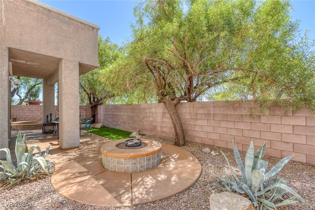 view of patio featuring an outdoor fire pit