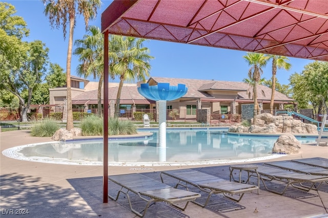 view of pool featuring a patio and pool water feature