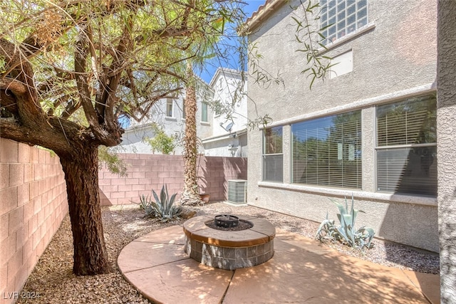 view of patio / terrace with a fire pit