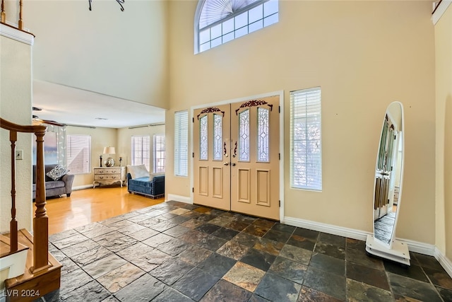 foyer with a towering ceiling