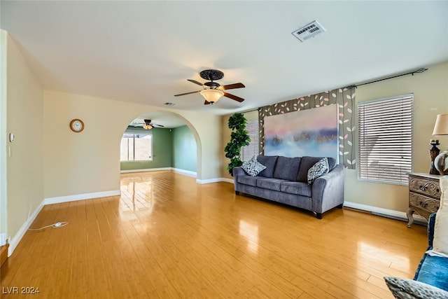 unfurnished living room with ceiling fan and light hardwood / wood-style floors