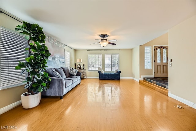 living room with hardwood / wood-style flooring and ceiling fan