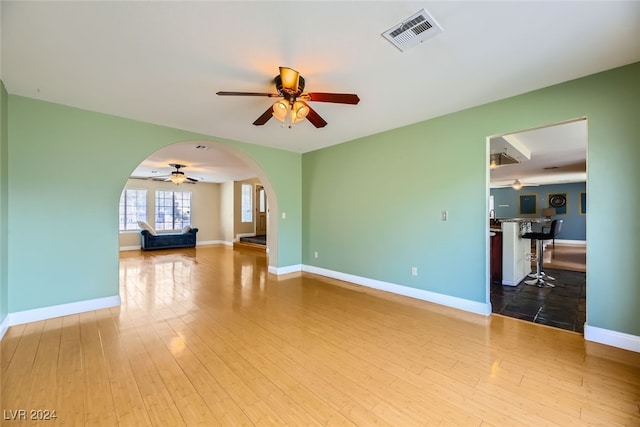 unfurnished living room featuring hardwood / wood-style floors