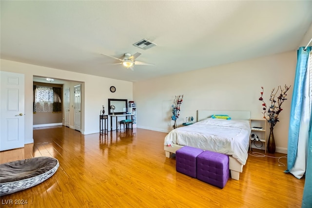 bedroom featuring wood-type flooring and ceiling fan