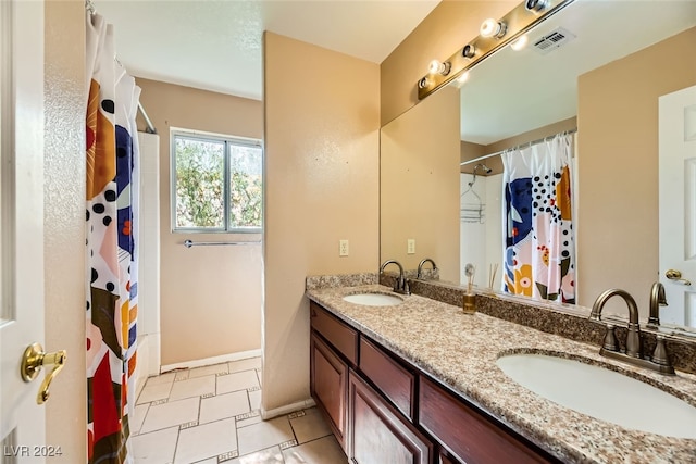 bathroom featuring walk in shower and vanity