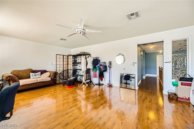 living room with hardwood / wood-style floors and ceiling fan