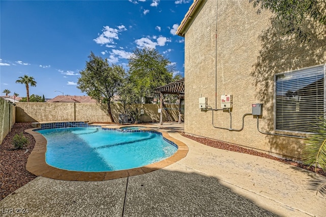 view of swimming pool featuring a pergola and a patio area