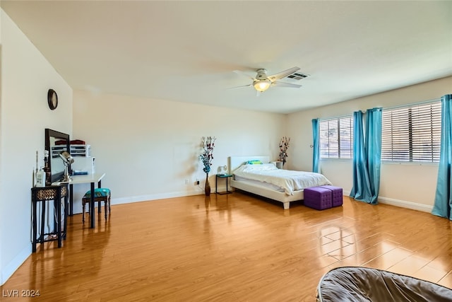 bedroom featuring wood-type flooring and ceiling fan