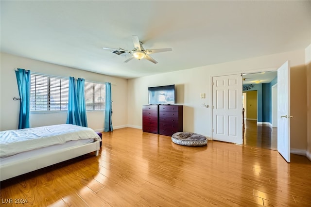 bedroom featuring ceiling fan and light hardwood / wood-style floors