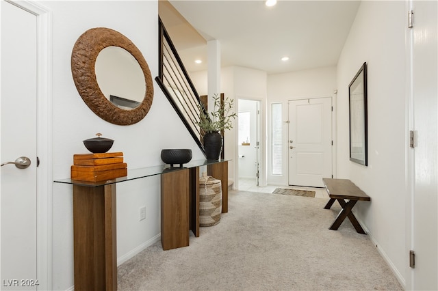 entrance foyer with light colored carpet