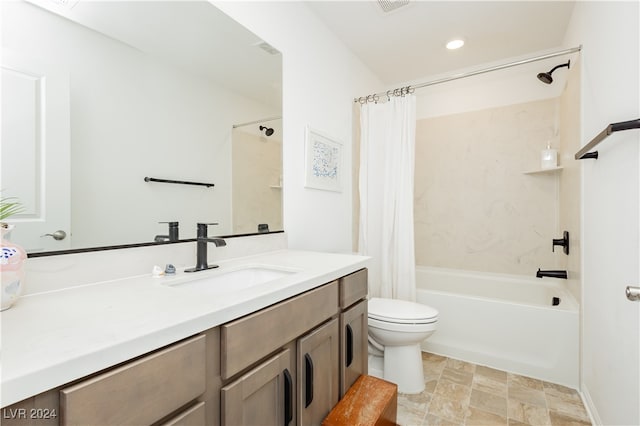 full bathroom with shower / bath combo, vanity, and toilet