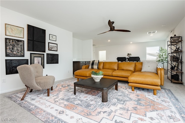 living room featuring ceiling fan and carpet floors