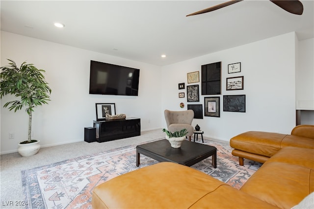 living room with ceiling fan and carpet floors