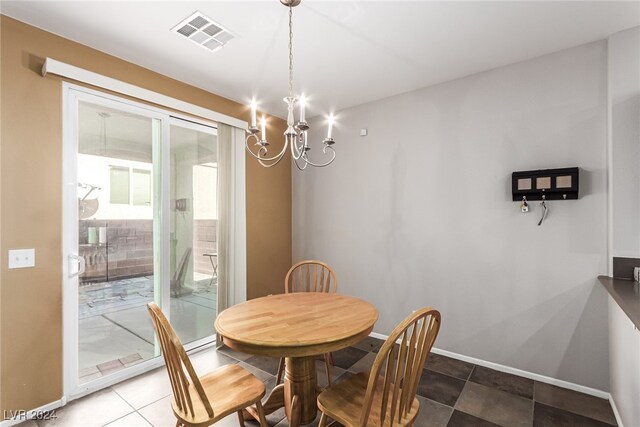 dining area with a notable chandelier