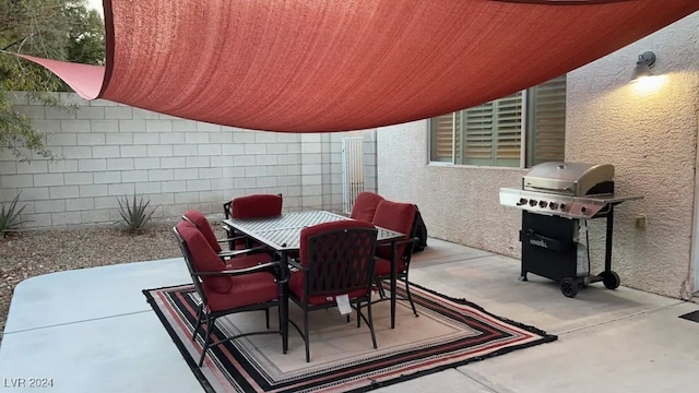 view of patio featuring a grill