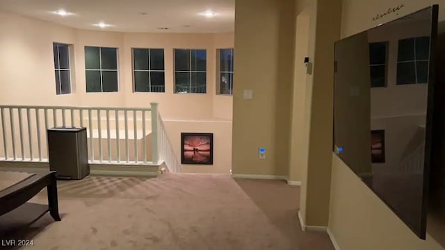 hallway with carpet flooring