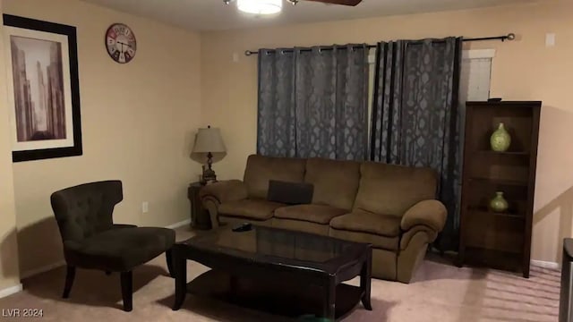 living room featuring ceiling fan and light colored carpet