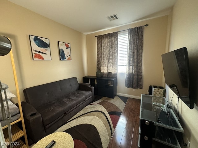 living room with dark hardwood / wood-style floors